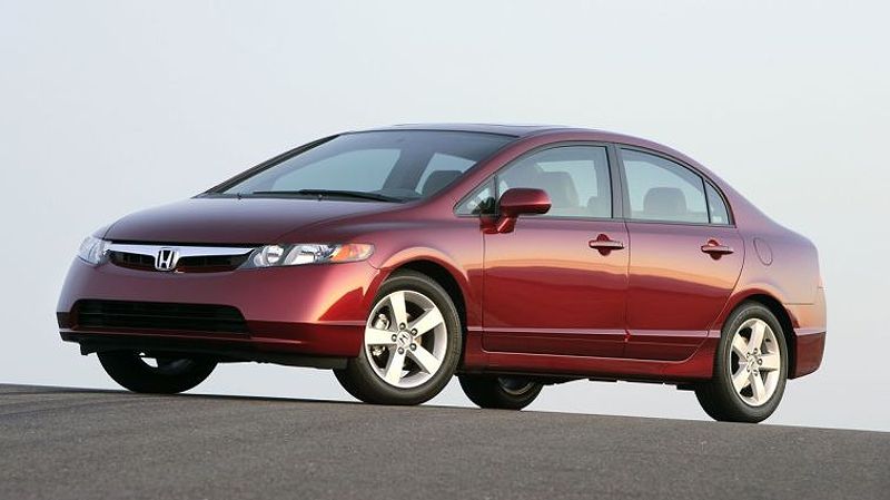 2007 Honda Civic Sedan in red at sunset