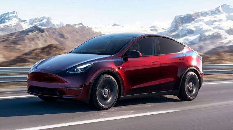 2024 Tesla Model Y driving on a road